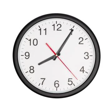 Round office clock shows time on white Фото