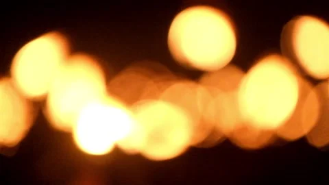 Round orange bokeh from torch light at night Stock Footage 287998630