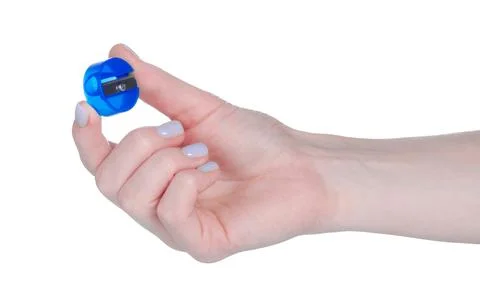 Round pencil sharpener in hand Stock Photos