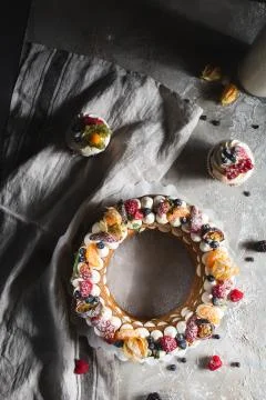 Round pie with berries on a gray background Stock Photos