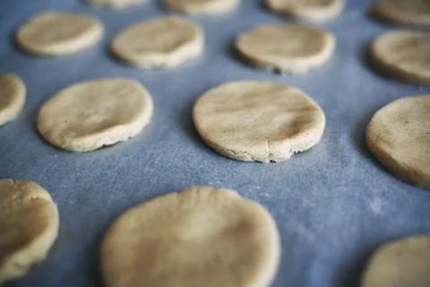 Round pieces of shortbread dough for making cookies or gingerbread Stock Photos