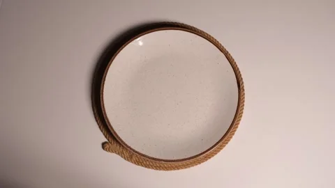 A round plate with rope decor and changing lighting Stock-Footage 330463869