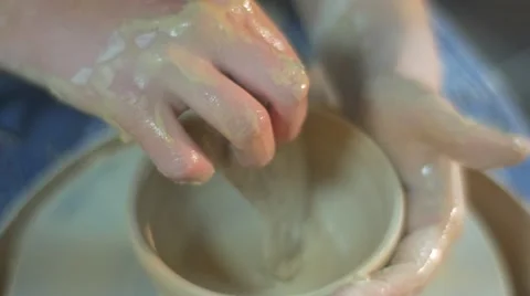A Round Pottery Craft is Made by a Little Girl, Dressed in Blue Apron and White Stock Footage 59122008
