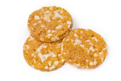 Round puffed multi-grain crispbreads with pumpkin on white background Stock Photos