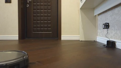 Round robotic vacuum cleaner Stock Footage 70233989