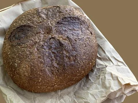 Round rye bread with additives.  Stock Photos