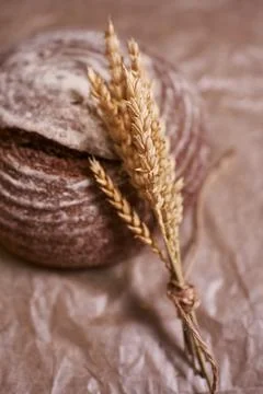 Round rye bread with a sprig of wheat Stock Photos