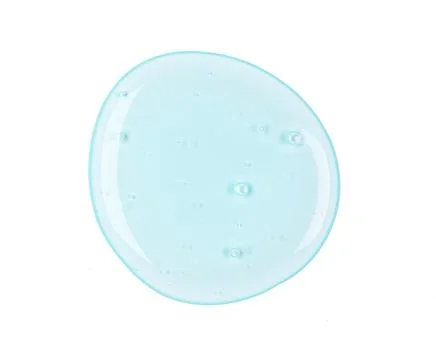 Round sample of drop transparent gel with bubbles isolated on white Foto stock