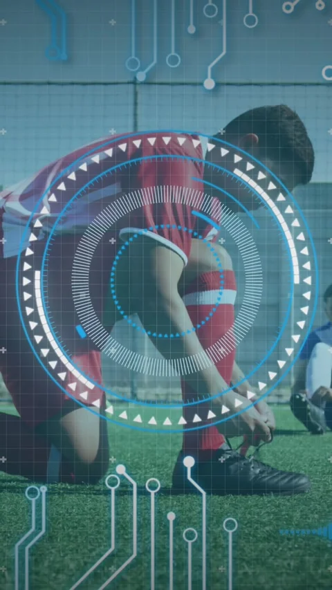 Round scanner and microprocessor connections against male soccer player tying Stockbeeldmateriaal 341918046