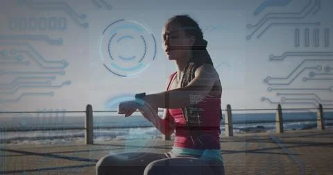 Round scanners and microprocessor connections against african american fit woman Stockfoto's