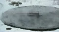 Round settler with overflowing water and vapour in winter season HD Footage