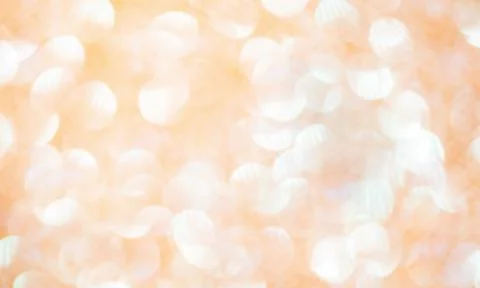 Round shape defocus lights are beige and white. Blurred bokeh. Material for t Stock Photos