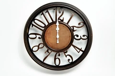 Round shape wall clock on a white background. Stock Photos