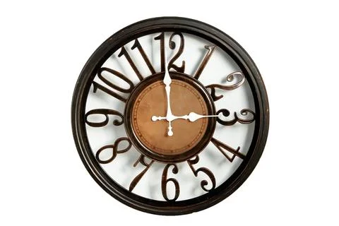 Round shape wall clock on a white background. Stock Photos