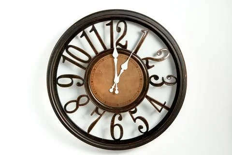 Round shape wall clock on a white background. Stock Photos
