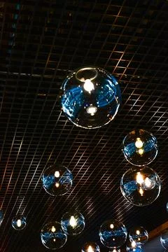 Round-shaped LED lamps on the ceiling in the interior of the restaurant Stock Photos