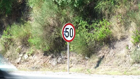 A round sign limiting the maximum speed of movement on the road for safe Stock Footage 201488612