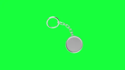 A round silver keychain rotates on a green screen in 3D rendering. Stock Footage 339233646
