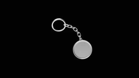 Round silver keychain rotating on black in 3D render. Stock Footage 338227109