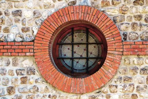 Round skylight with bricks and bars Stock Photos