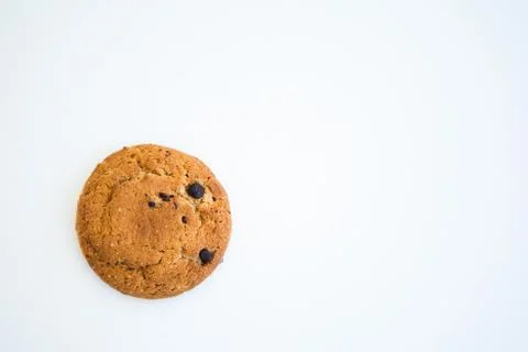 Round smiling cookie on the white background with copy space for your text. O Stock Photos