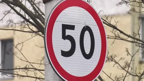 Round speed limit road sign on the road. 50 km per hour. Stock-Footage 274412675