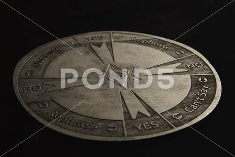 Round spiritual chart carved to wood used for communication with pendulum Stock Photos