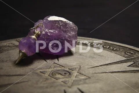 Round spiritual chart carved to wood used for communication with pendulum Stock Photos