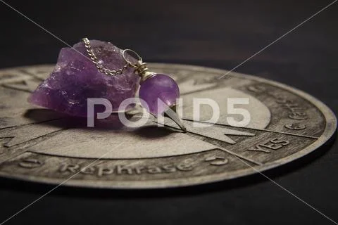 Round spiritual chart carved to wood used for communication with pendulum Stock Photos