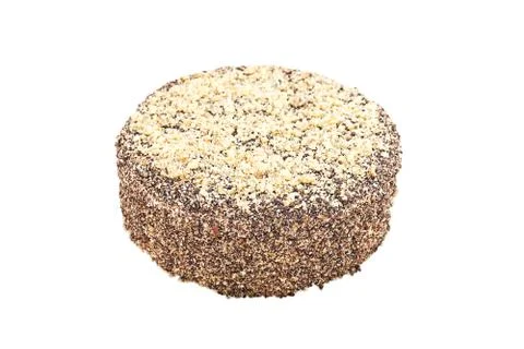 Round sponge nut cake. Close-up on white background. Stock Photos