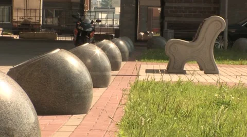 Round stone bed to the ground the green grass Stock Footage 5084120