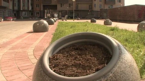 Round stone bed to the ground the green grass Stock Footage 5086108