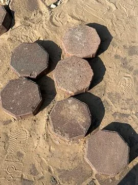 Round stone pattern on sandy ground, natural shapes detail Stock Photos