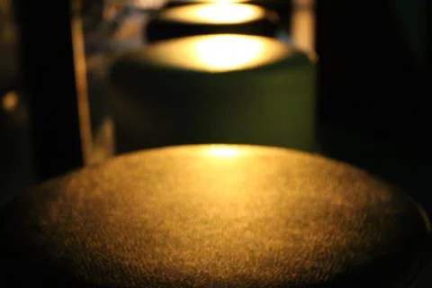 Round stool in the light Stock Photos