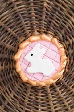 Round sugar cookie with a white Easter bunny made of fondant Stock Photos