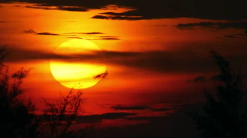 Round sun and dark clouds Stock Footage 221623413