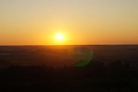 Round sun at sunset in a clear sky Stock Photos