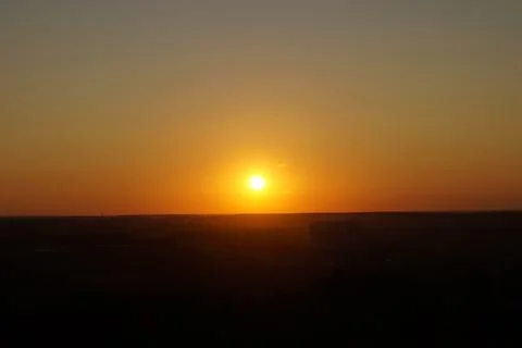 Round sun at sunset in a clear sky Stock Photos