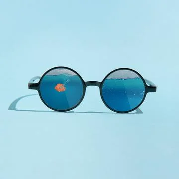 Round sunglasses with dark frames and tinted lenses Stock Photos