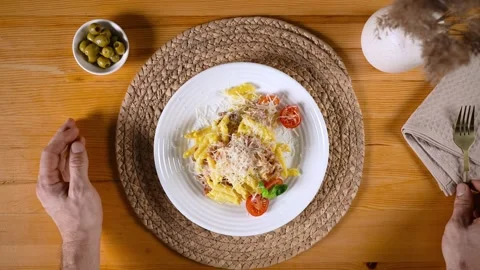 A round table cloth with a fork and knife on it Stock Footage 317457744