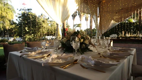 Round table decoration elegant tableware with beautiful sunset around Stock Footage 221459290