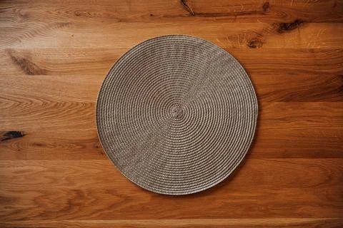 Round table mat or placemat on oakwood table Stock Photos