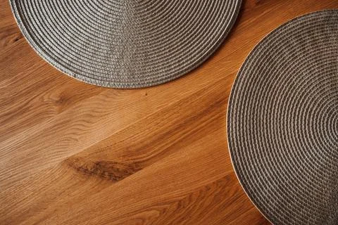 Round table mat or placemat on oakwood table Stock Photos