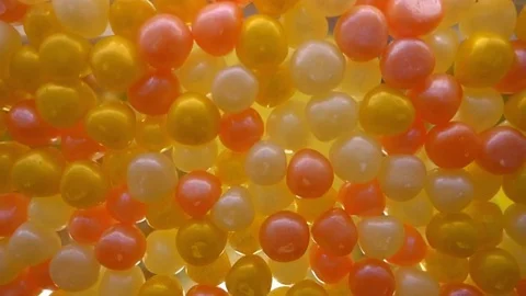 Round, tasty, glossy, multicolored, translucent appealing candied fruit jelly Stock Footage 71651096