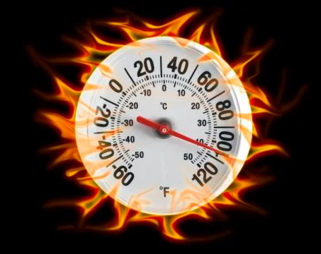 Round thermometer on fire Stock Photos