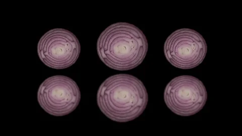 Round Three slices of red onion rotate on a black background. Stock Footage 125639371