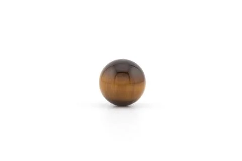 Round tiger eye stone on a plain background Stock Photos