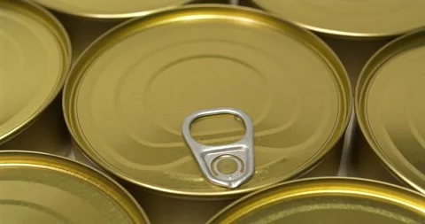 Round tin cans with lids of yellow color Stock Footage 310011858