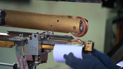 Round tin container Stitching, automatic welding tin container in a factory Stock Footage 246921870