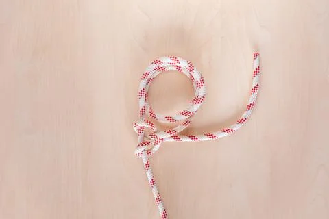 Round turn and two half hitches ship knot on wooden background Stock Photos